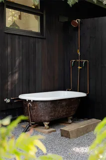 a backyard of a house with table and chairs