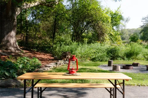 a view of a garden with lawn chairs
