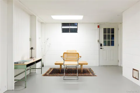a view of a patio with a table chairs and a garden