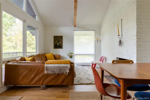 a bedroom with a bed dresser and a window