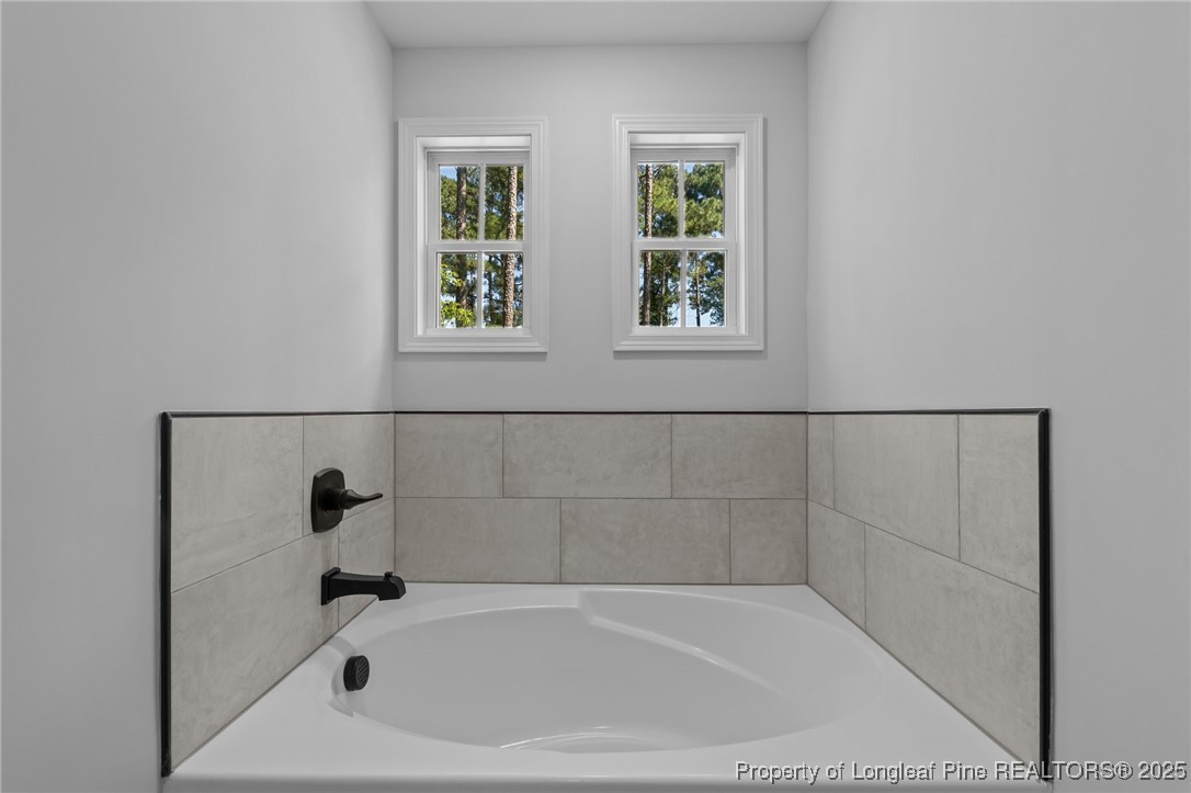 15880 Fox Lane Wagram, NC 28396 - Photo 19 of 33 a bathroom with a bathtub