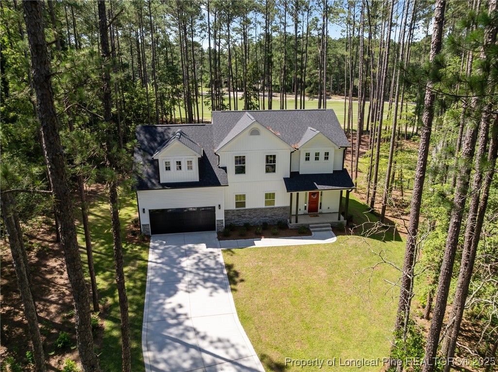 15880 Fox Lane Wagram, NC 28396 - Photo 2 of 33 a view of house with a large tree in front of it