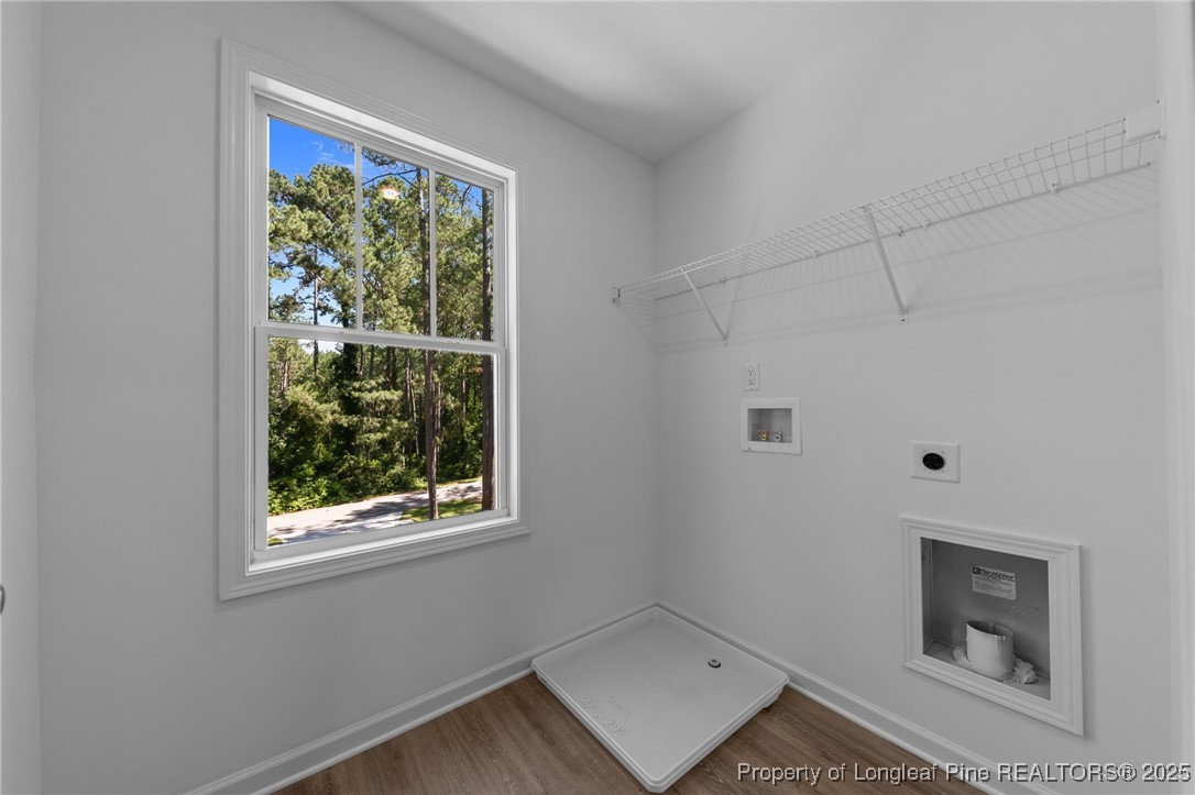 15880 Fox Lane Wagram, NC 28396 - Photo 25 of 33 a room with window and a wooden floor