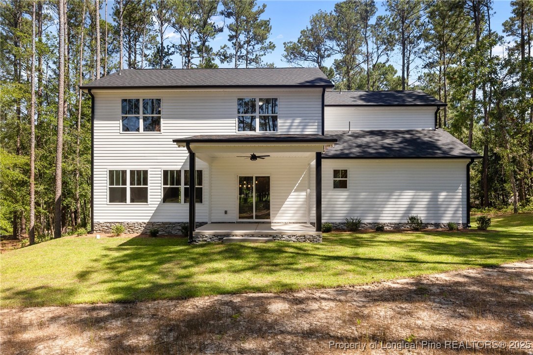 15880 Fox Lane Wagram, NC 28396 - Photo 29 of 33 a view of a house with a swimming pool