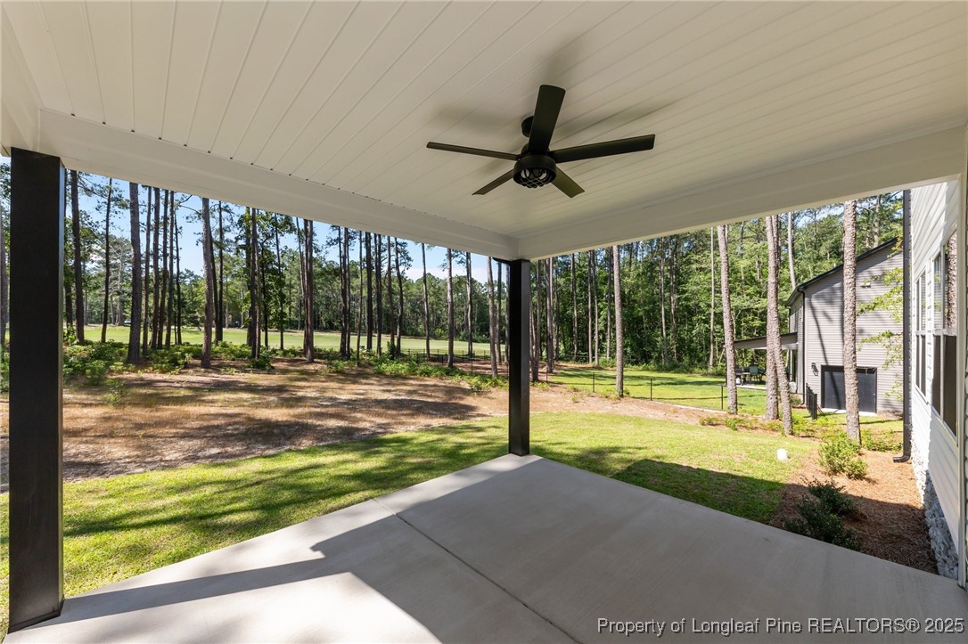 15880 Fox Lane Wagram, NC 28396 - Photo 30 of 33 a view of swimming pool with an outdoor space and seating area