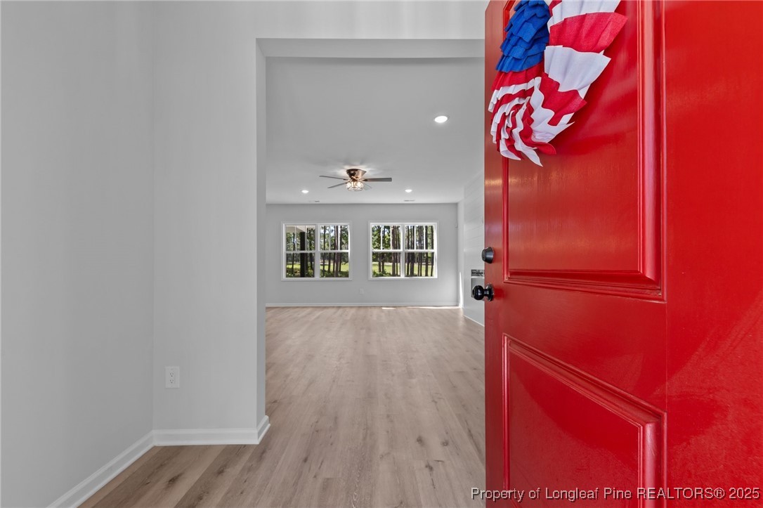 15880 Fox Lane Wagram, NC 28396 - Photo 4 of 33 a view of a room with wooden floor and windows