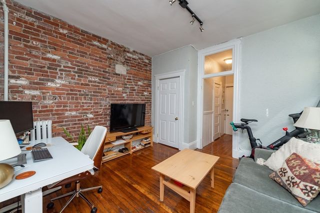 a workspace with furniture and wooden floor