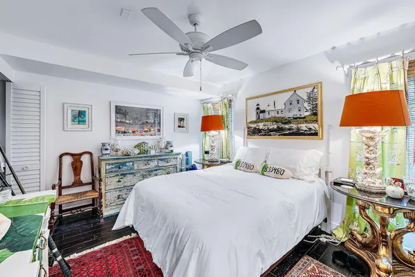 a bedroom with a bed and glass door