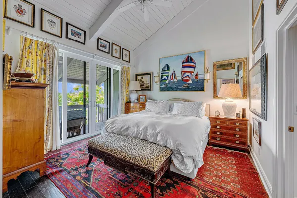 a bedroom with furniture and a window