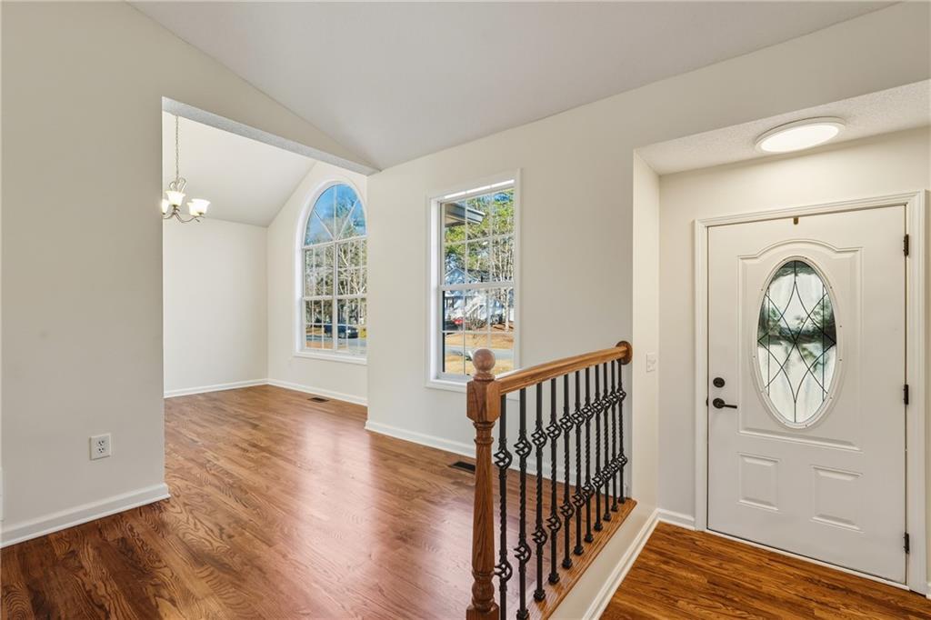 615 Amberwood Place Euharlee, GA 30145 - Photo 11 of 37 a view of a hallway with wooden floor and windows