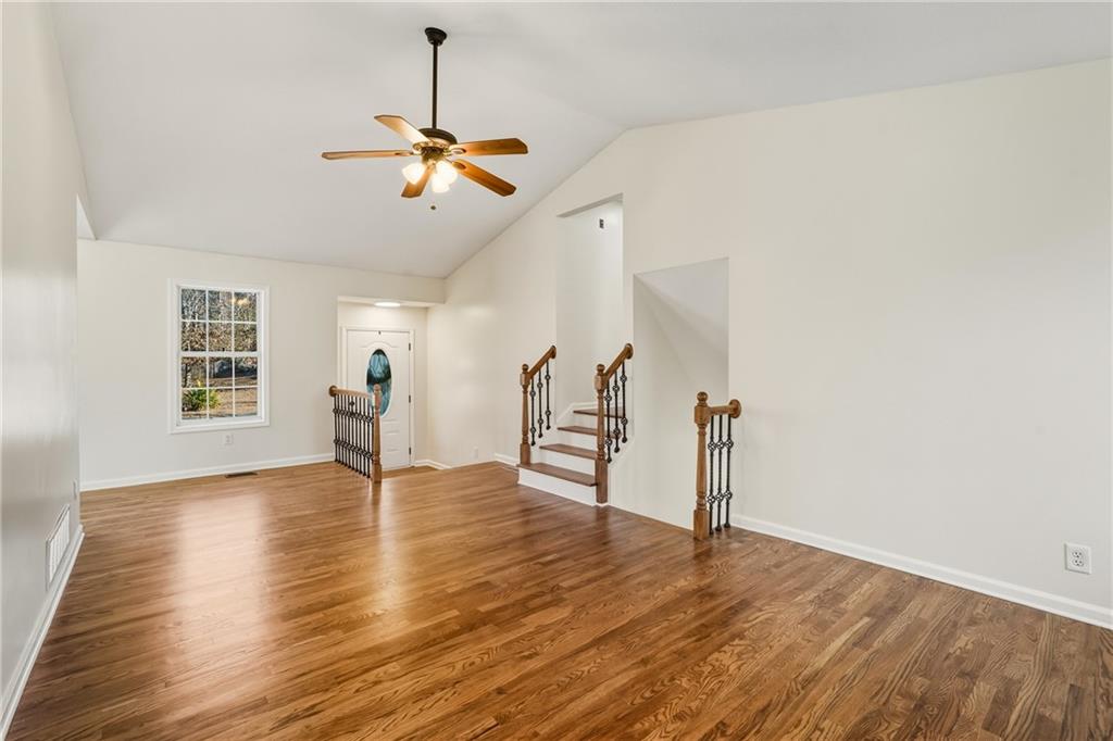 615 Amberwood Place Euharlee, GA 30145 - Photo 13 of 37 a view of empty room with wooden floor and fan