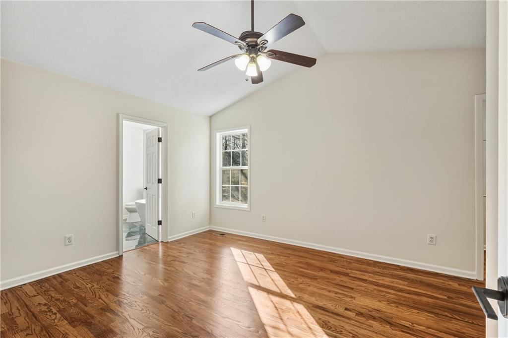 615 Amberwood Place Euharlee, GA 30145 - Photo 15 of 37 wooden floor in an empty room with a window