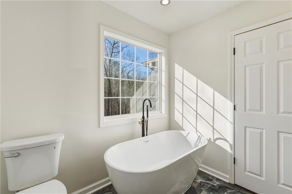 615 Amberwood Place Euharlee, GA 30145 - Photo 20 of 37 a bathroom with a sink and mirror with toilet