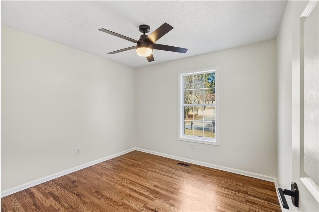 615 Amberwood Place Euharlee, GA 30145 - Photo 26 of 37 a view of an empty room with wooden floor and a window