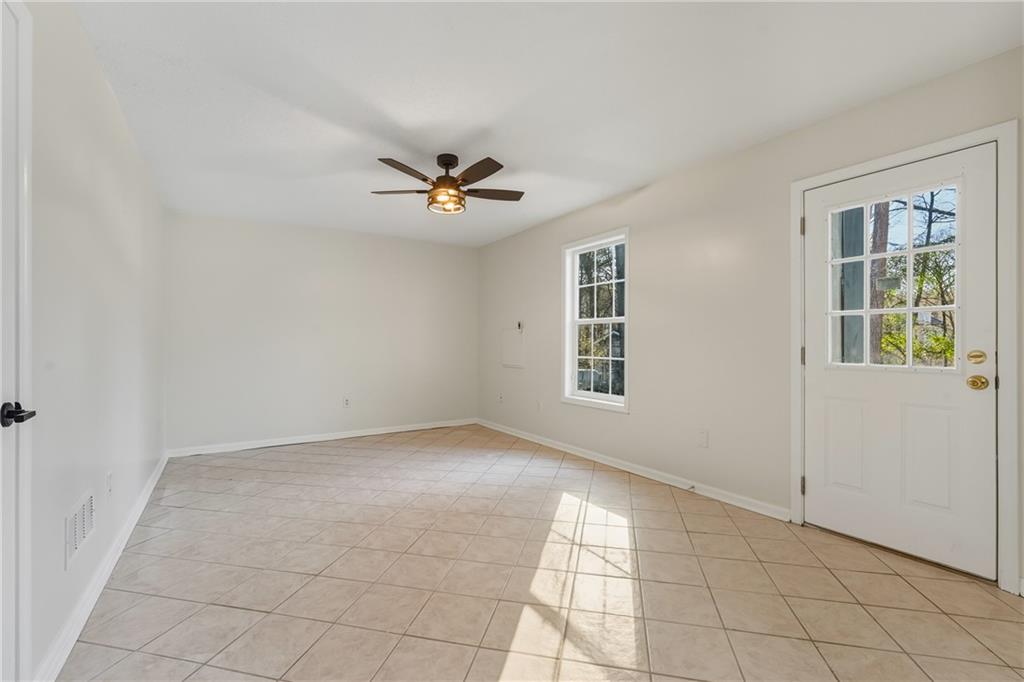 615 Amberwood Place Euharlee, GA 30145 - Photo 27 of 37 an empty room with windows and ceiling fan