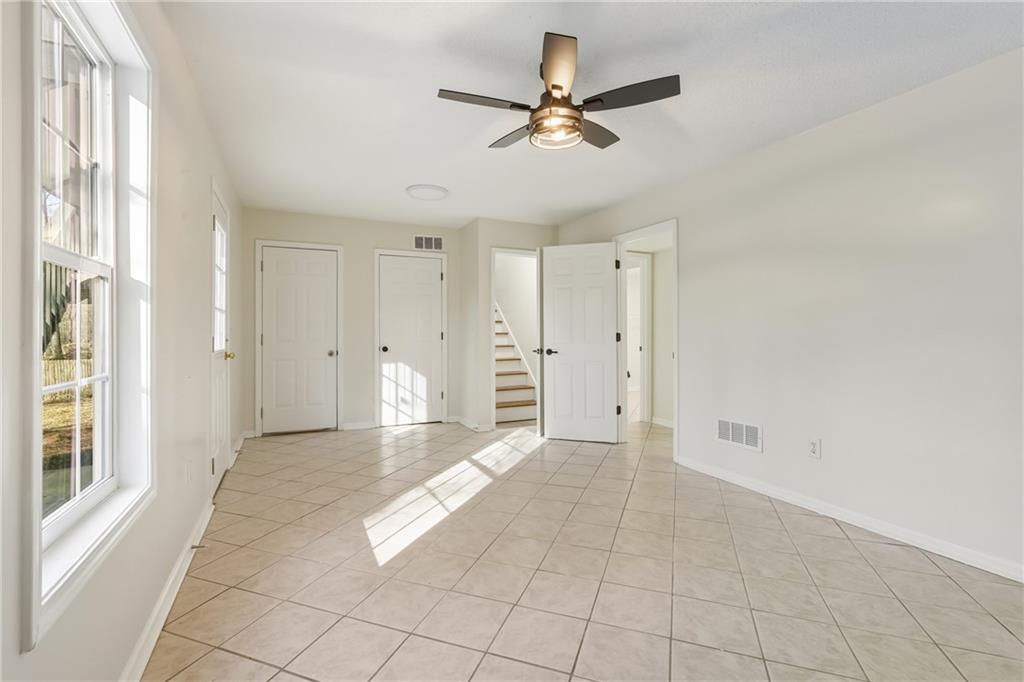 615 Amberwood Place Euharlee, GA 30145 - Photo 29 of 37 a view of a livingroom with a ceiling fan and window