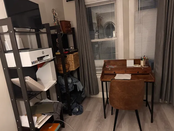 a dining room with furniture and wooden floor