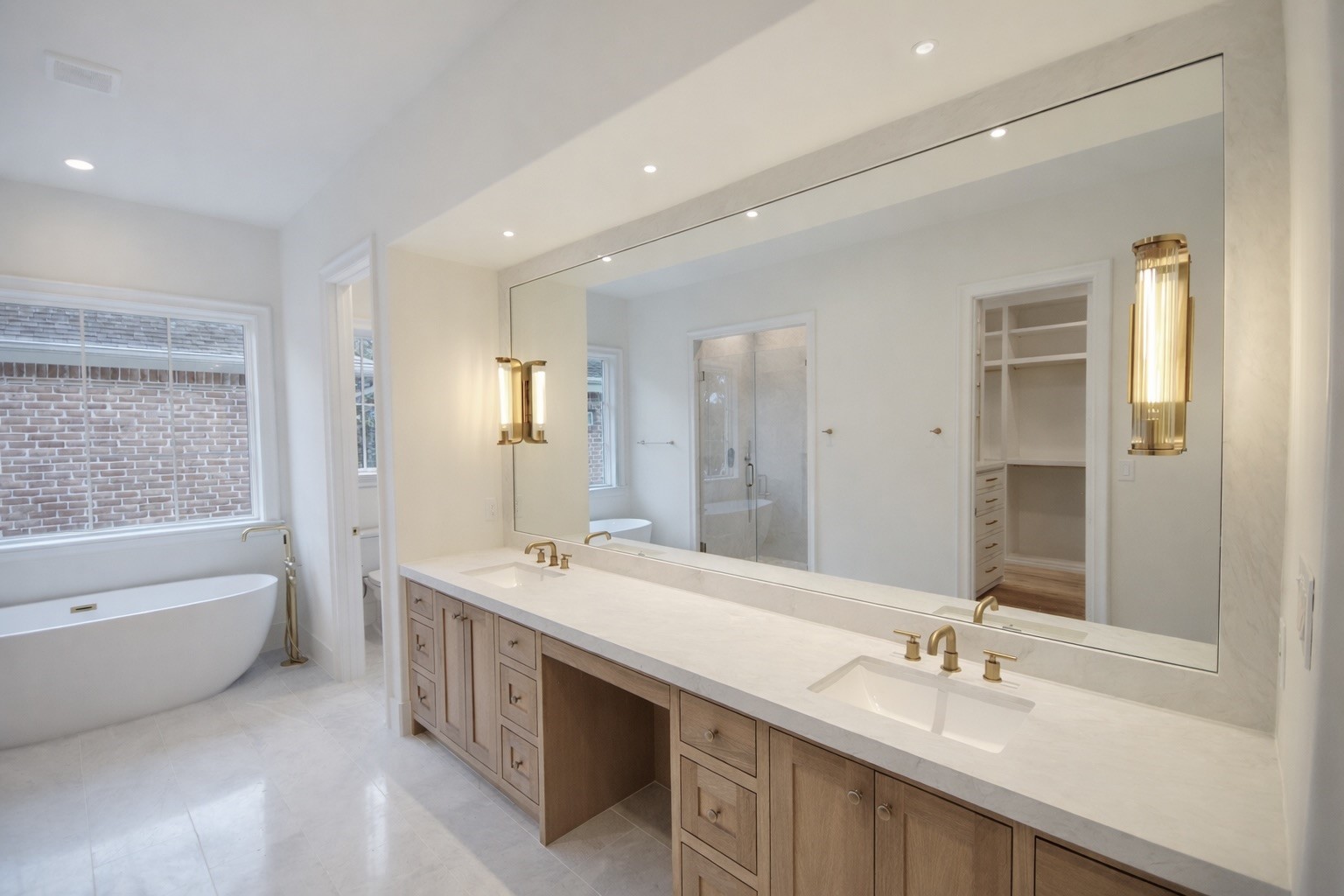 4107 Whitman Street Houston, TX 77027 - Photo 11 of 29 a bathroom with a tub double sink shower and mirror