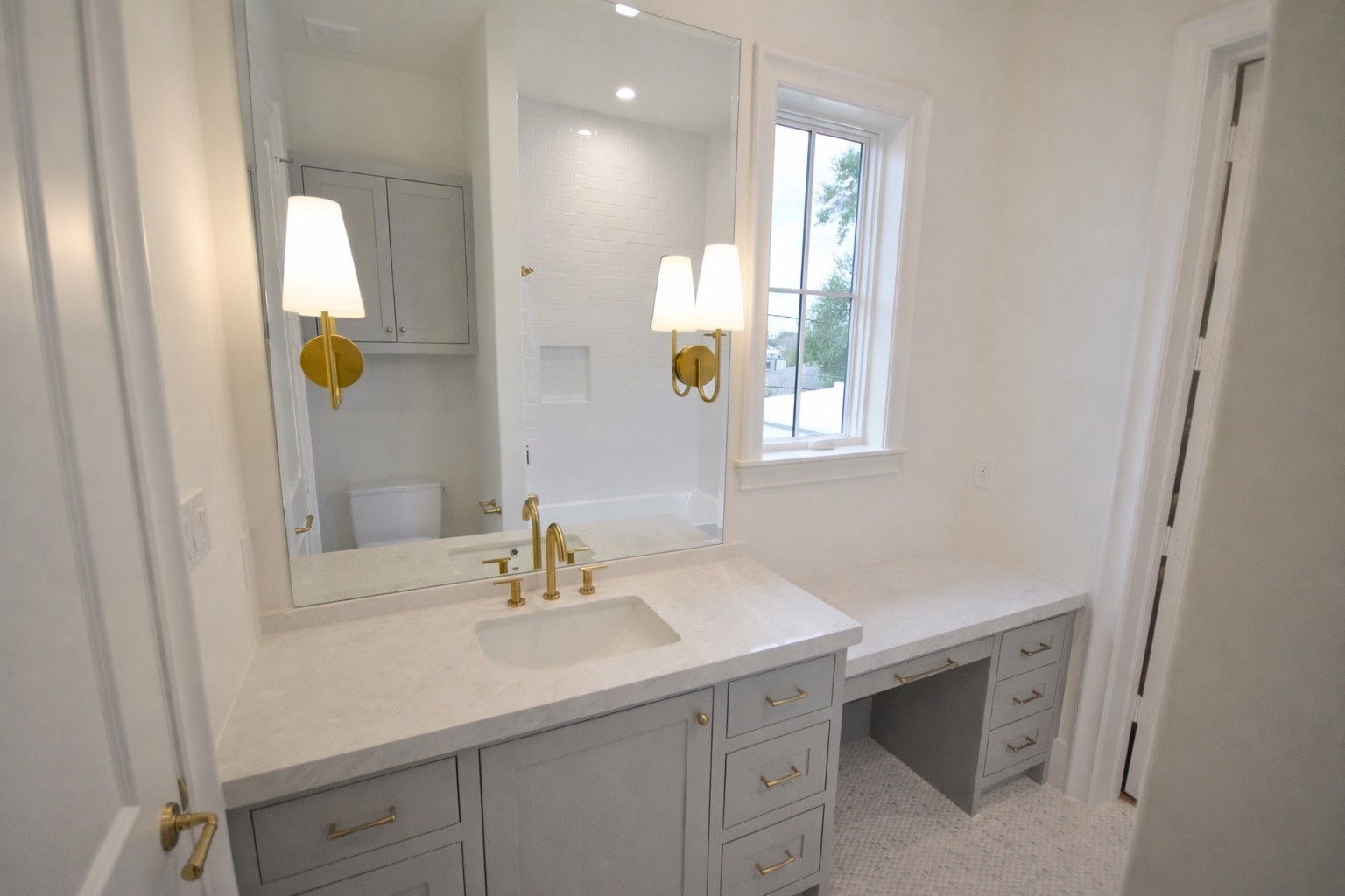 4107 Whitman Street Houston, TX 77027 - Photo 19 of 29 a bathroom with a sink and two mirror