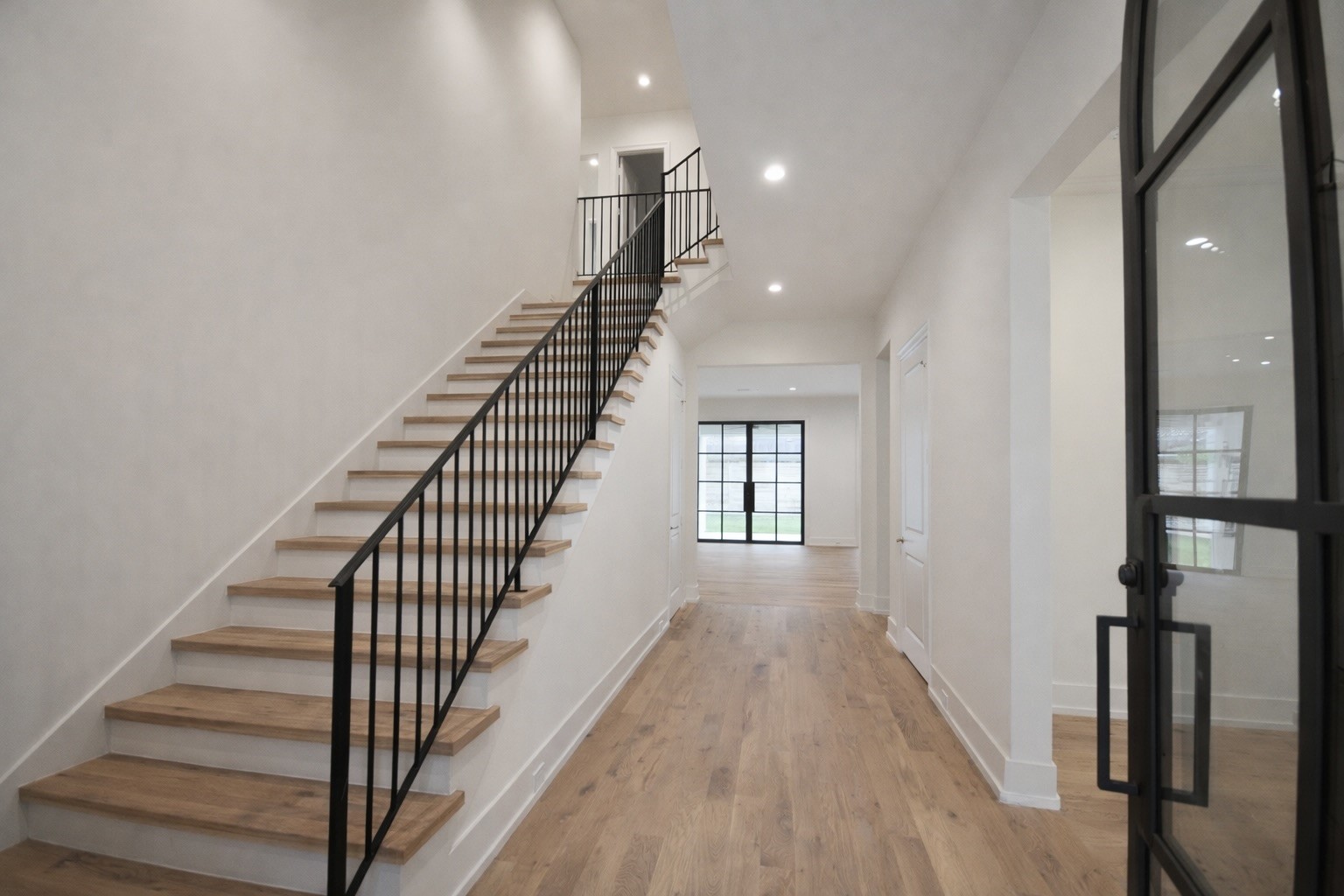 4107 Whitman Street Houston, TX 77027 - Photo 2 of 29 a view of a hallway with wooden floor and entryway