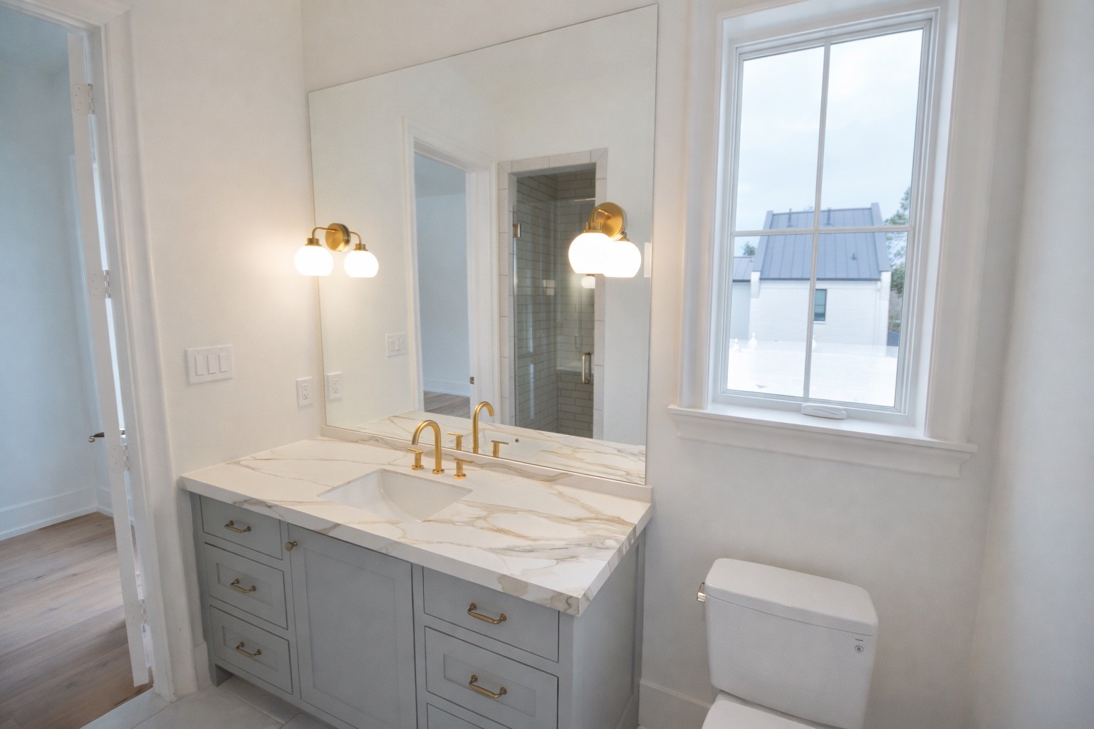 4107 Whitman Street Houston, TX 77027 - Photo 21 of 29 a bathroom with a granite countertop sink mirror and a toilet