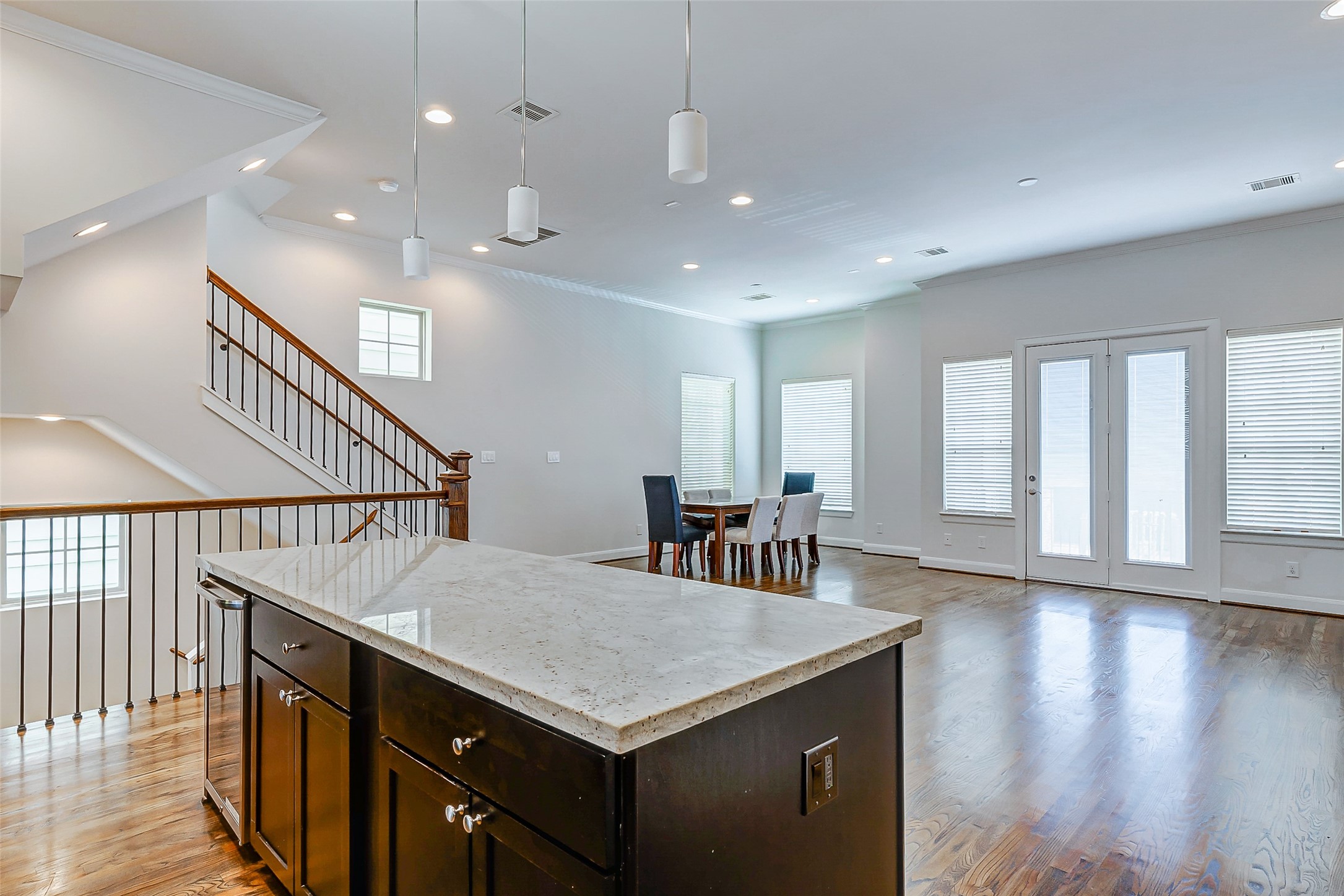 2209 Chenevert Street, Unit C Houston, TX 77003 - Photo 11 of 26 a kitchen with counter and wooden floor