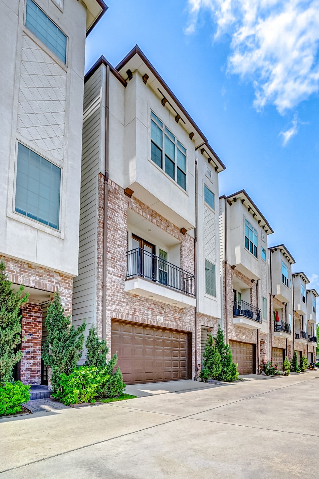 2209 Chenevert Street, Unit C Houston, TX 77003 - Photo 2 of 26 a front view of a building with a garden