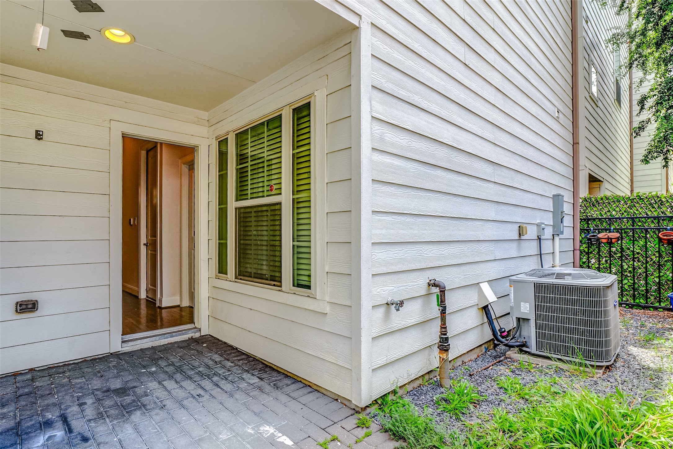 2209 Chenevert Street, Unit C Houston, TX 77003 - Photo 24 of 26 a wooden bench sitting in front of a door