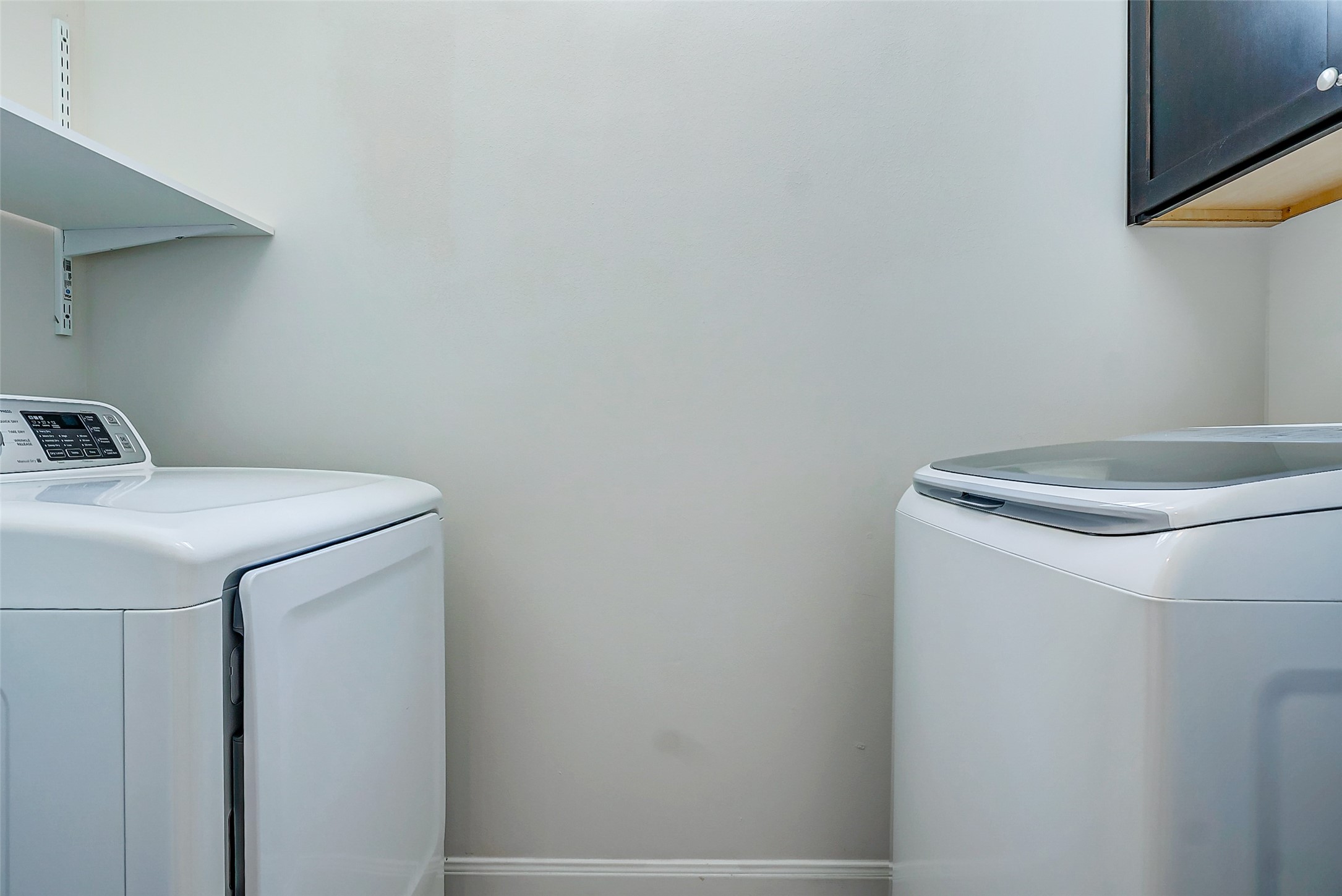 2209 Chenevert Street, Unit C Houston, TX 77003 - Photo 25 of 26 a utility room with dryer and washer