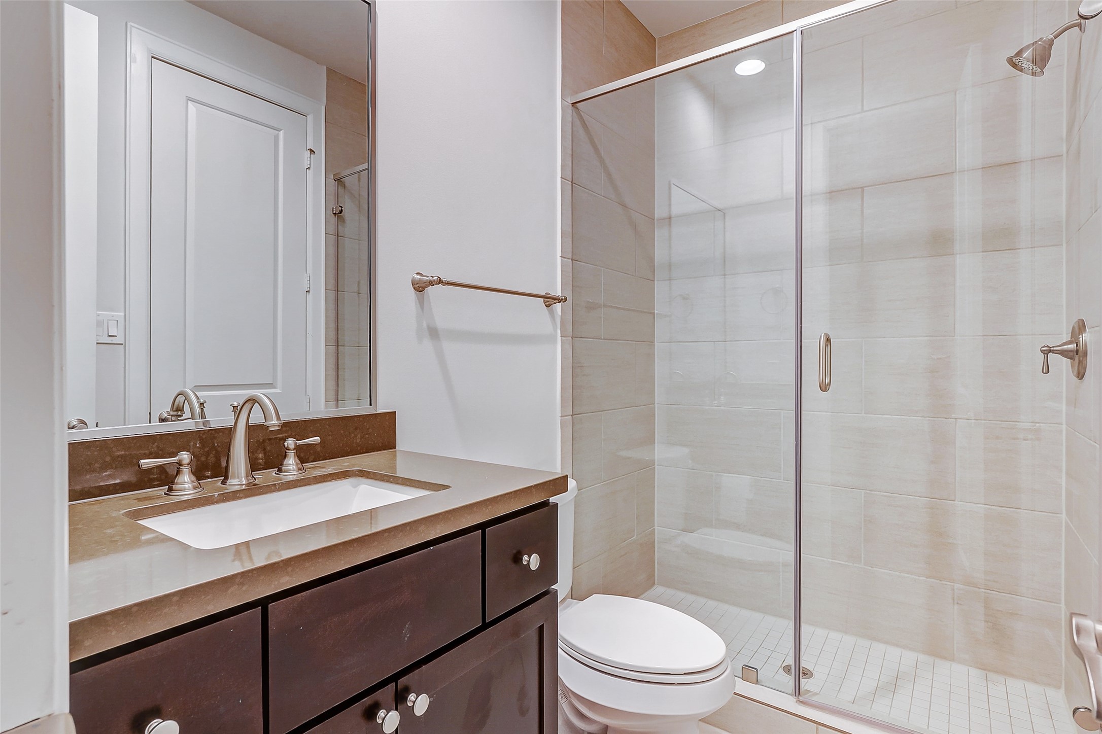 2209 Chenevert Street, Unit C Houston, TX 77003 - Photo 6 of 26 a bathroom with a sink toilet vanity and shower