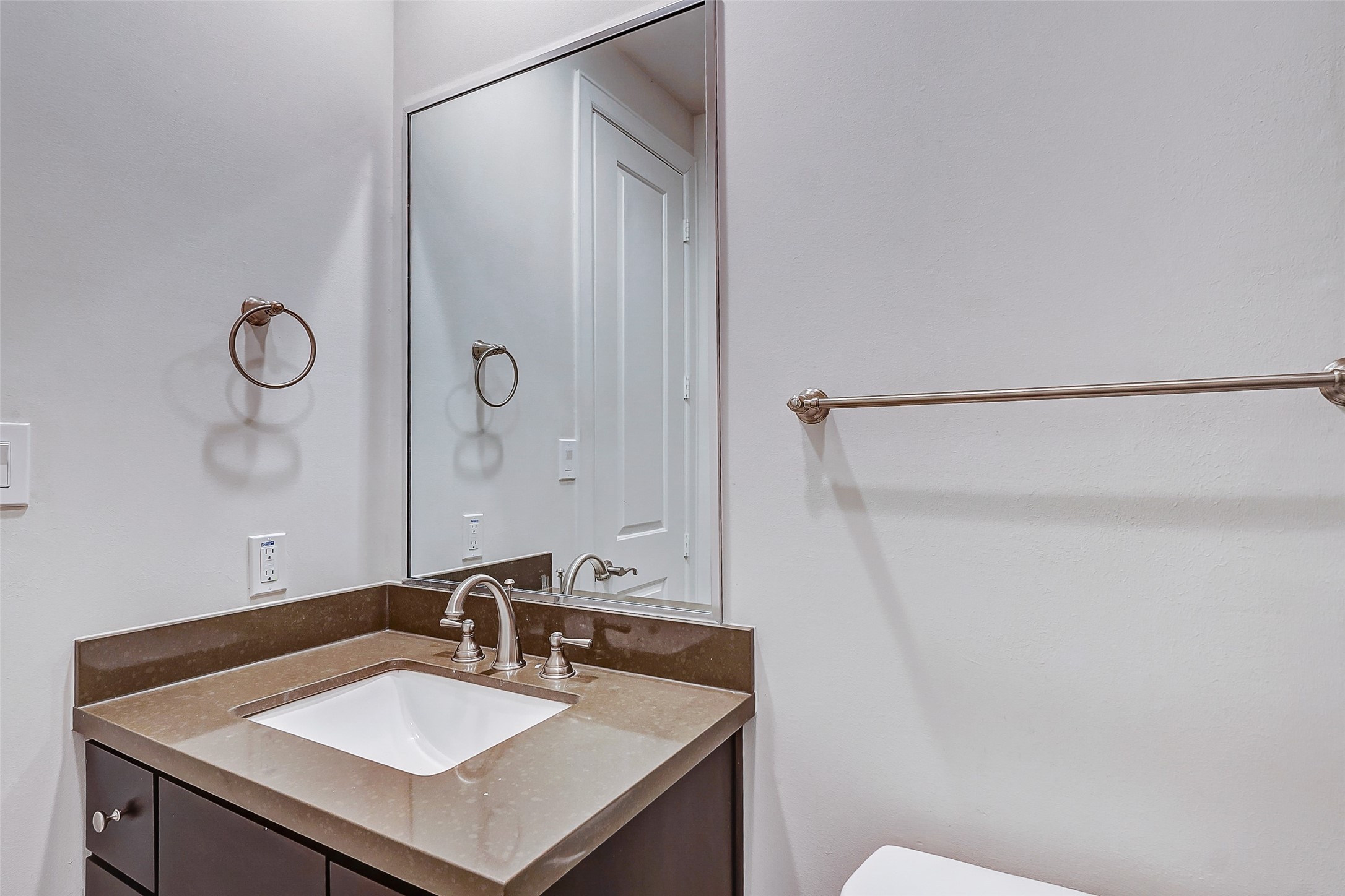 2209 Chenevert Street, Unit C Houston, TX 77003 - Photo 7 of 26 a bathroom with a sink and a mirror