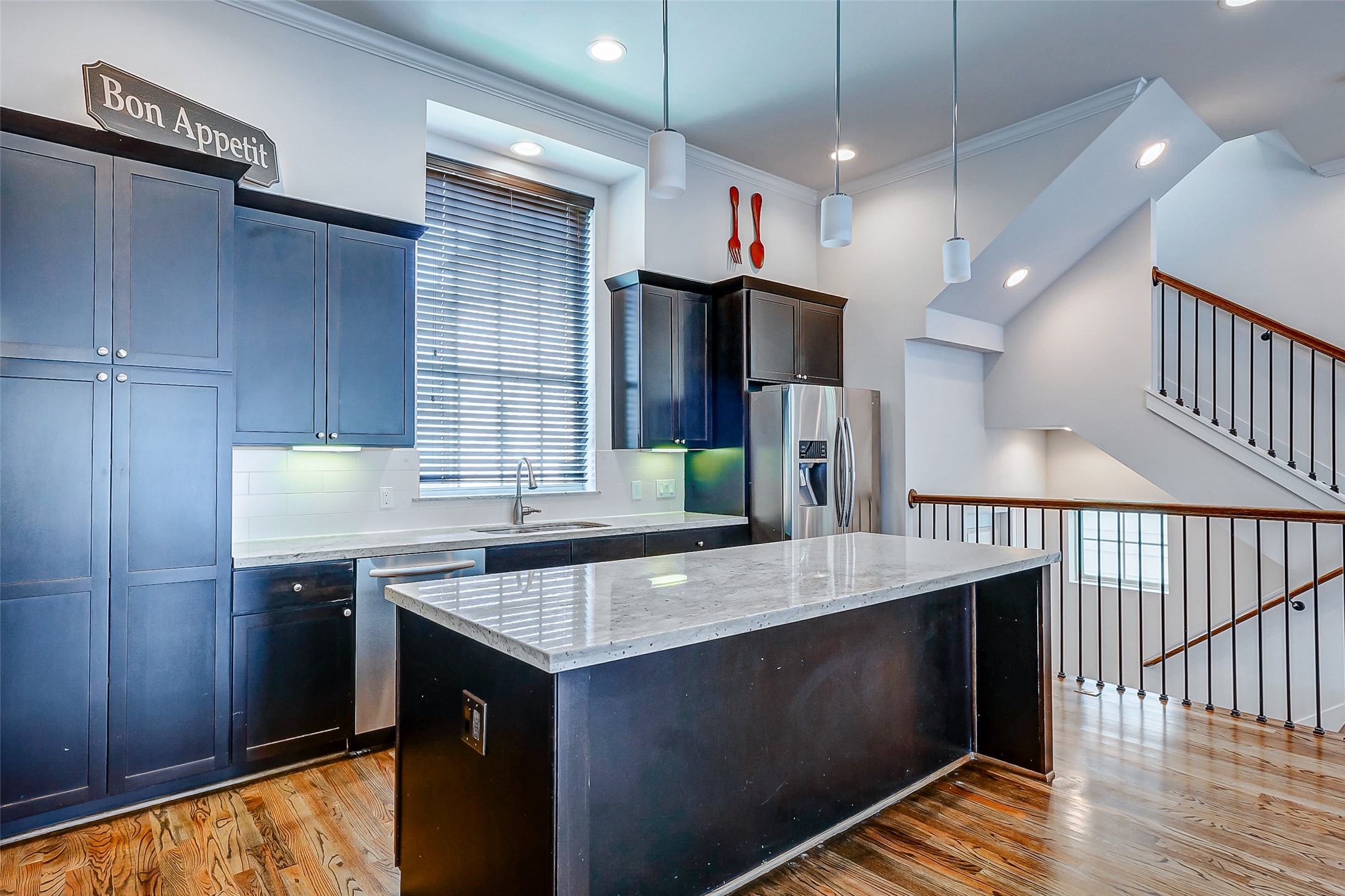 2209 Chenevert Street, Unit C Houston, TX 77003 - Photo 9 of 26 a kitchen with stainless steel appliances granite countertop a sink a stove and a refrigerator