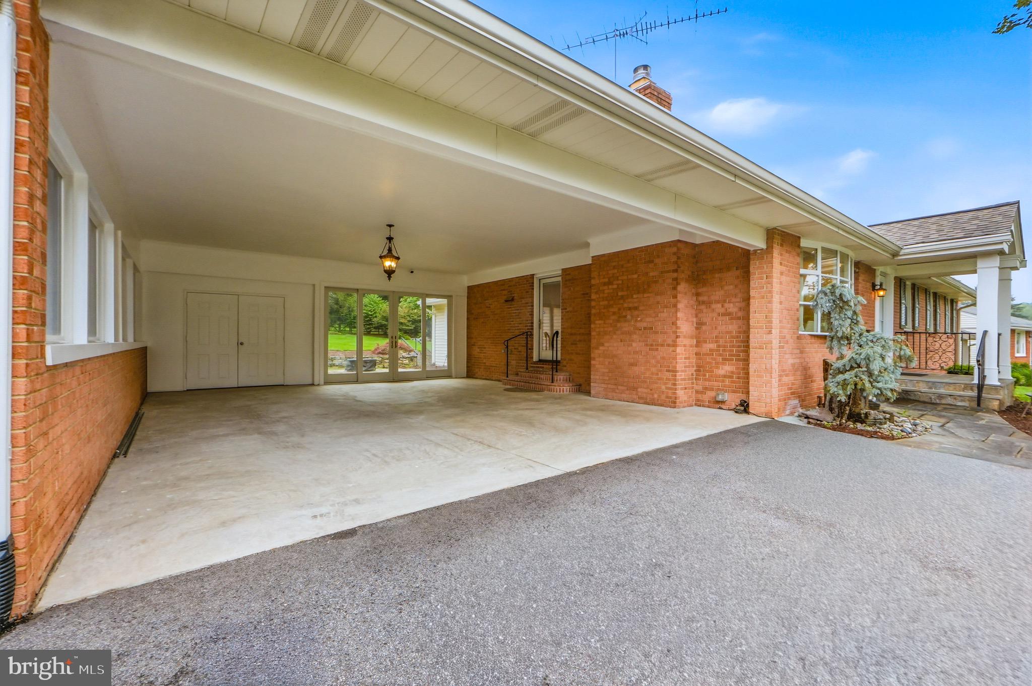 2508 Redmiles Drive Silver Spring, MD 20905 - Photo 31 of 44 Carport with doors to storage shed and paved patio