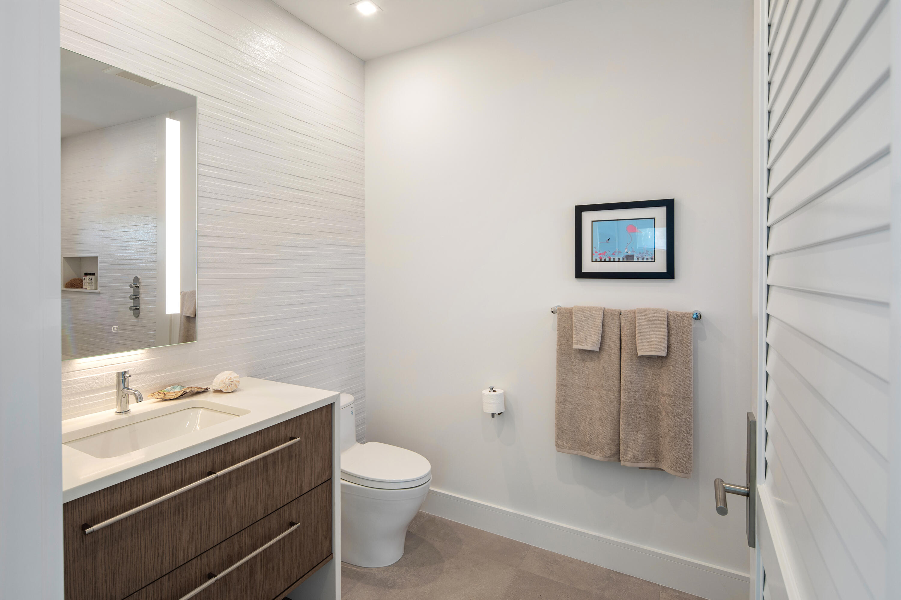 1614 Washington Street Key West, FL 33040 - Photo 2 of 59 a bathroom with a toilet sink and a mirror