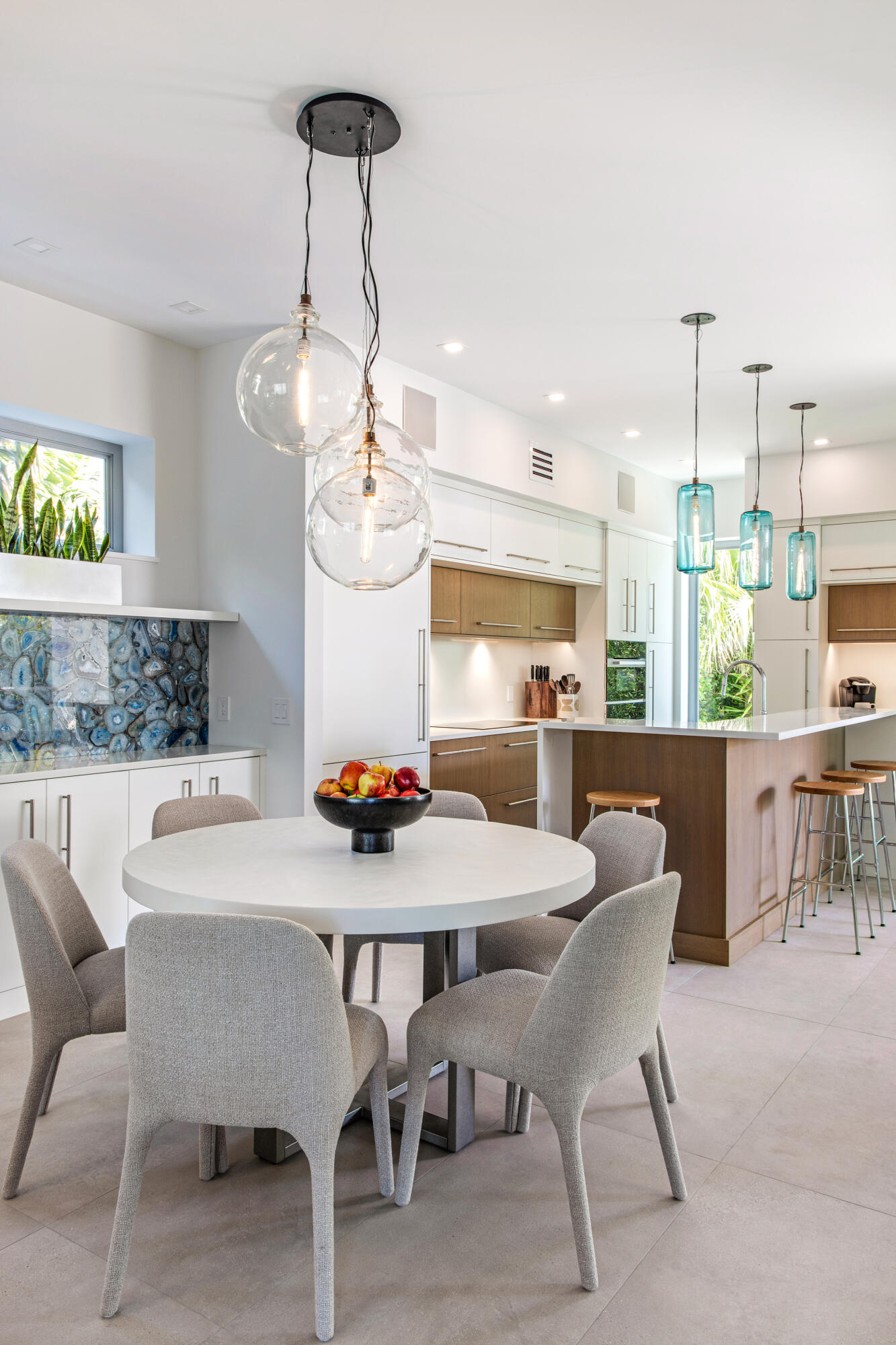 1614 Washington Street Key West, FL 33040 - Photo 31 of 59 a kitchen with a dining table chairs and chandelier