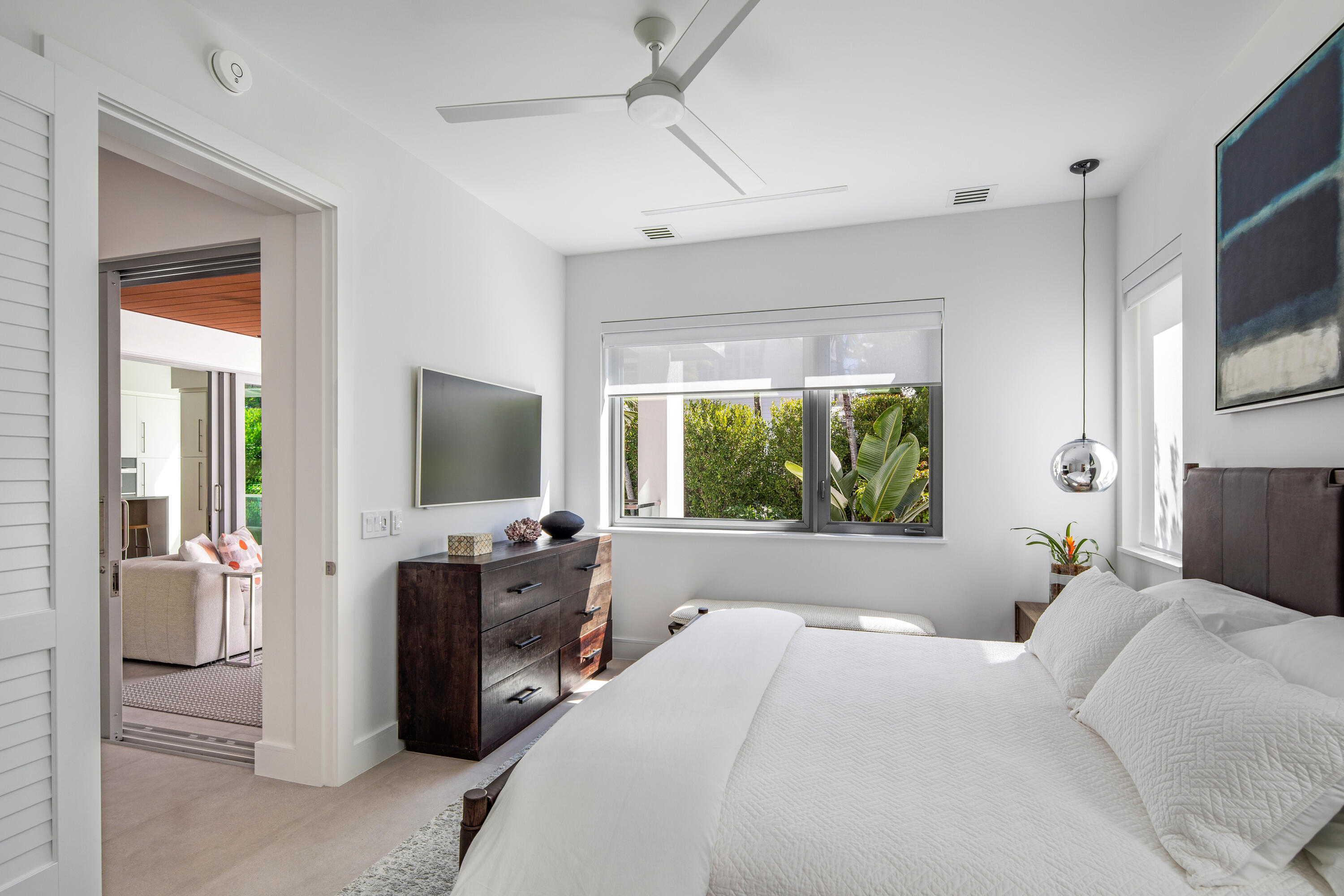 1614 Washington Street Key West, FL 33040 - Photo 40 of 59 a bedroom with a bed flat screen tv and a large window