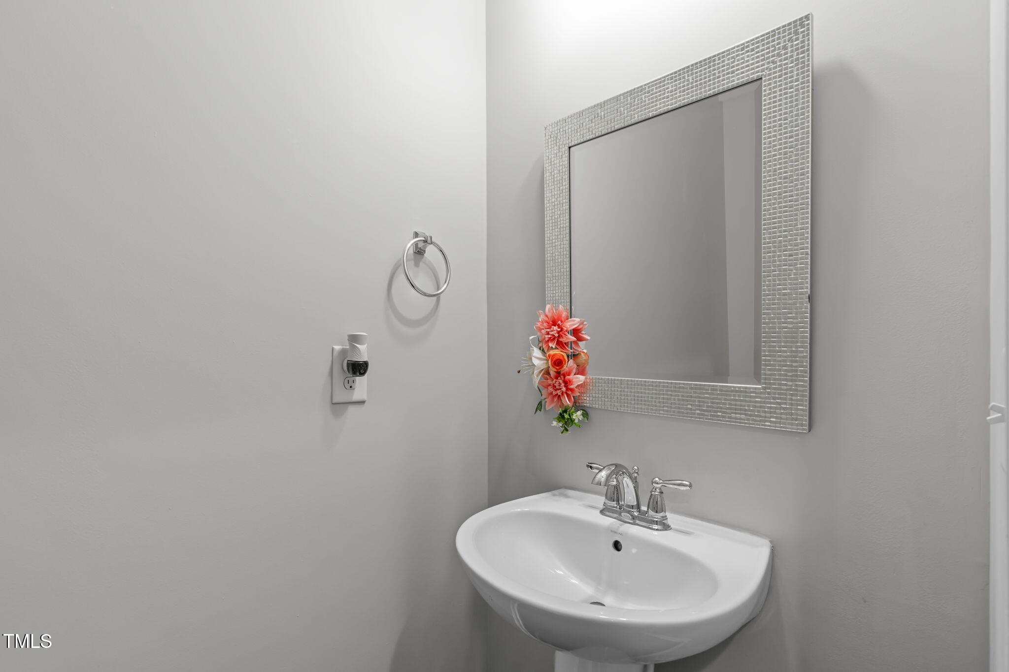 157 Writing Rock Place Apex, NC 27539 - Photo 11 of 28 a bathroom with a sink and a mirror