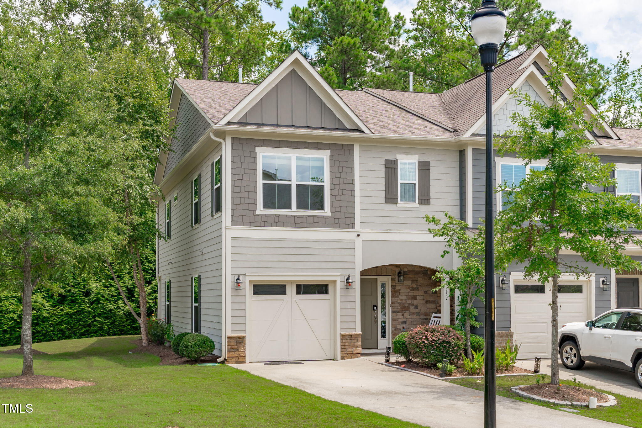 157 Writing Rock Place Apex, NC 27539 - Photo 24 of 28 a front view of a house with garden