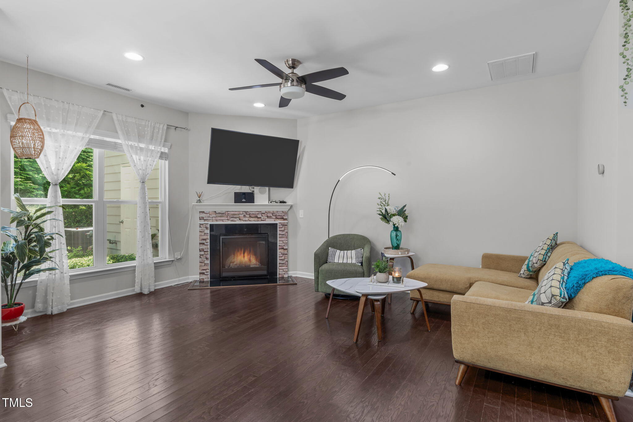 157 Writing Rock Place Apex, NC 27539 - Photo 9 of 28 a living room with furniture and a fireplace