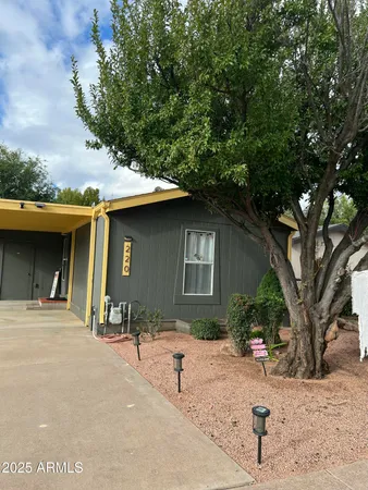 a house with trees in the background