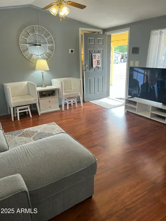 a bedroom with a bed and a night stand