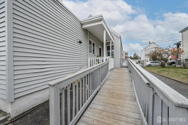 a view of a house with wooden deck