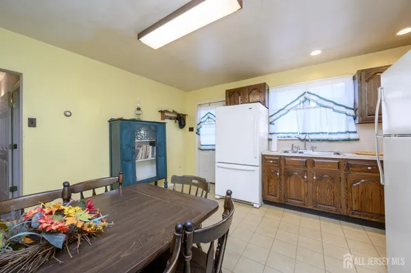 a kitchen with cabinets a sink and appliances