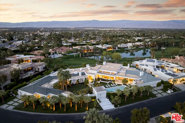 a view of a palm trees in front of a house