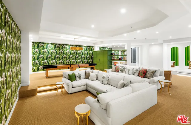 a spacious bathroom with a tub sink and mirror