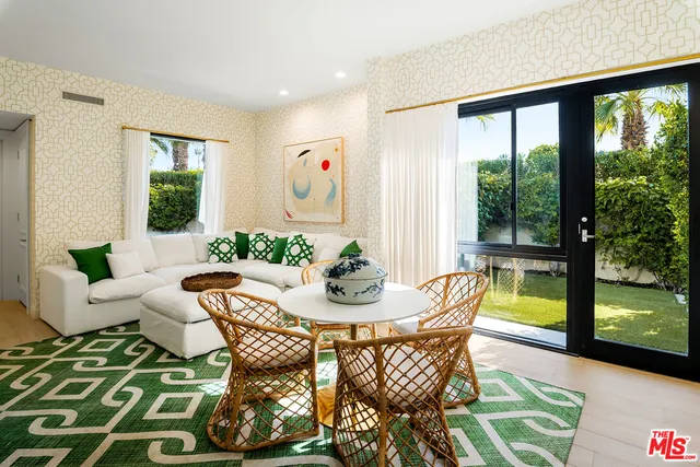 a view of swimming pool with outdoor seating