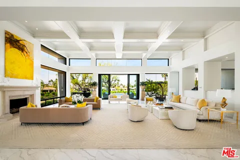 a view of a chairs and table in patio with a lake view