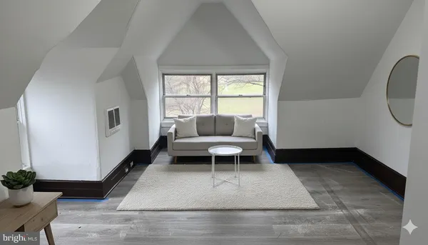 a living room with a couch and a table