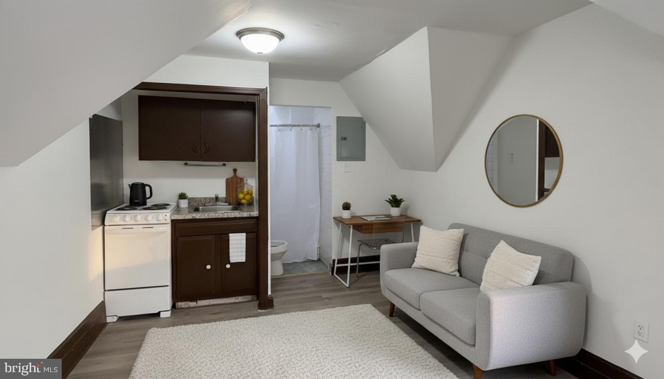 4635 Leiper Street, Unit 5 Philadelphia, PA 19124 - Photo 3 of 9 a living room with furniture and a flat screen tv