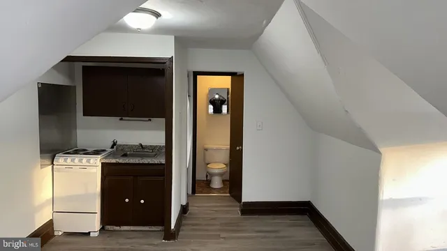 a kitchen with a stove and a refrigerator